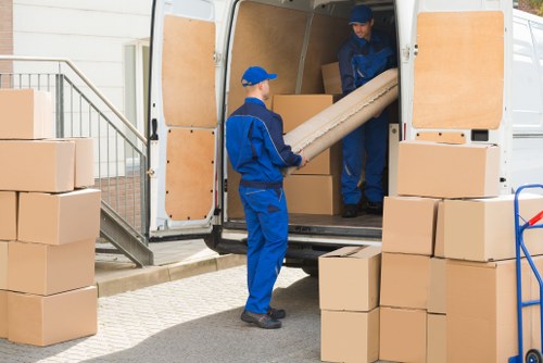 Removal team helping with same-day moving in a Belsize Park street