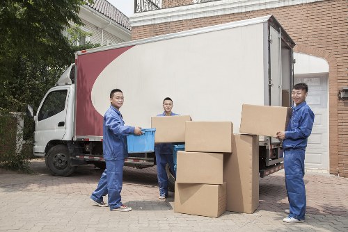 Professional movers handling a flat move in Belsize Park with stair access