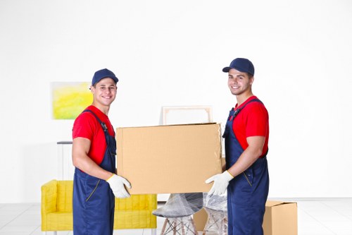 Professional office moving team handling business furniture in Belsize Park