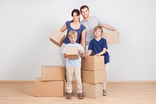 Professional movers loading furniture from a Belsize Park property