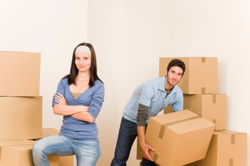 Packed boxes and wrapped furniture ready for a Belsize Park apartment removal