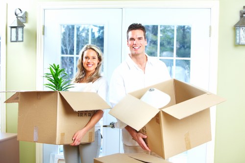 Local movers loading a van for a same-day relocation in north-west London