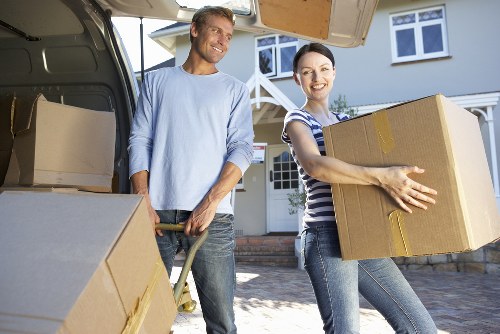 Professional movers planning access on a Belsize Park street